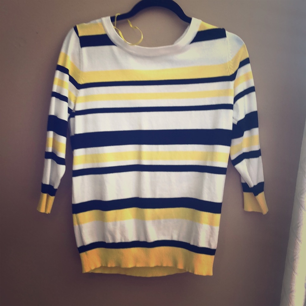 A yellow white and black striped woman’s shirt